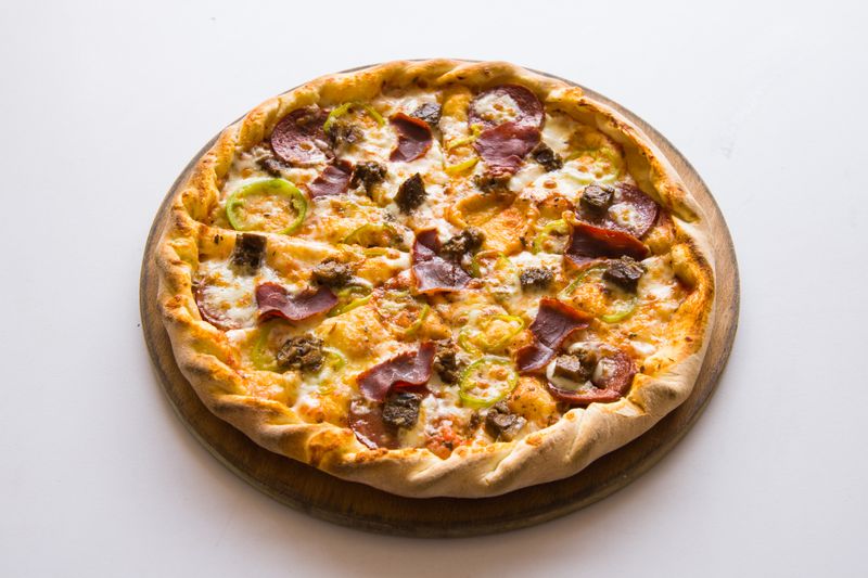 A finished pizza inn dish ready to serve